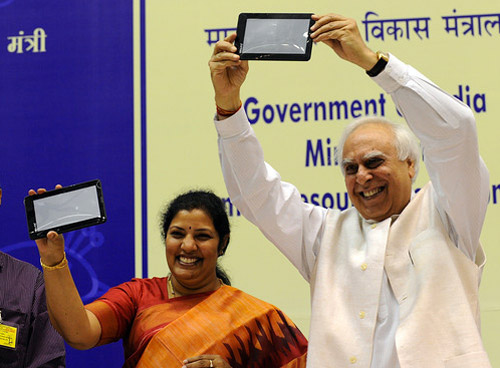 Indian Minister Sibal Displaying the Aakash Tablet