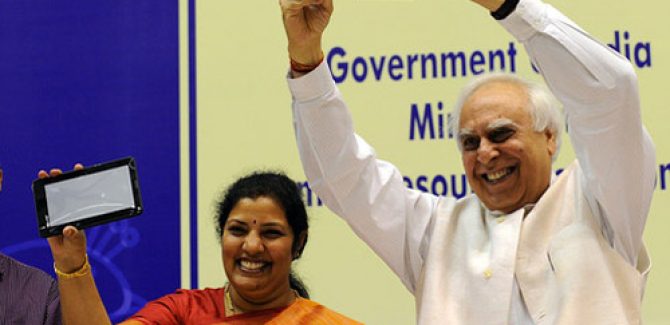 Indian Minister Sibal Displaying the Aakash Tablet